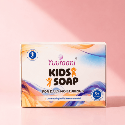 Premium product photograph of Yuvraani Kids Soap for Daily Moisturizing, featuring the colorful soap packaging with water droplets, soap bubbles, and a warm natural light background, specially formulated for children aged 5 years and above.