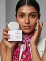 Model holding Yuvraani Whitening Triple Base Soap with product box, highlighting a brightening skincare routine for clear, radiant, and healthy-looking skin.