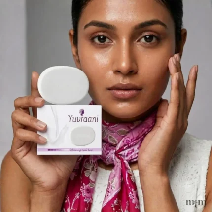 Model holding Yuvraani Whitening Triple Base Soap with product box, highlighting a brightening skincare routine for clear, radiant, and healthy-looking skin.