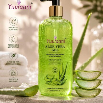 Yuvraani Aloe Vera Gel pump bottle with fresh aloe vera leaves resting on a minimalist concrete slab and sand backdrop