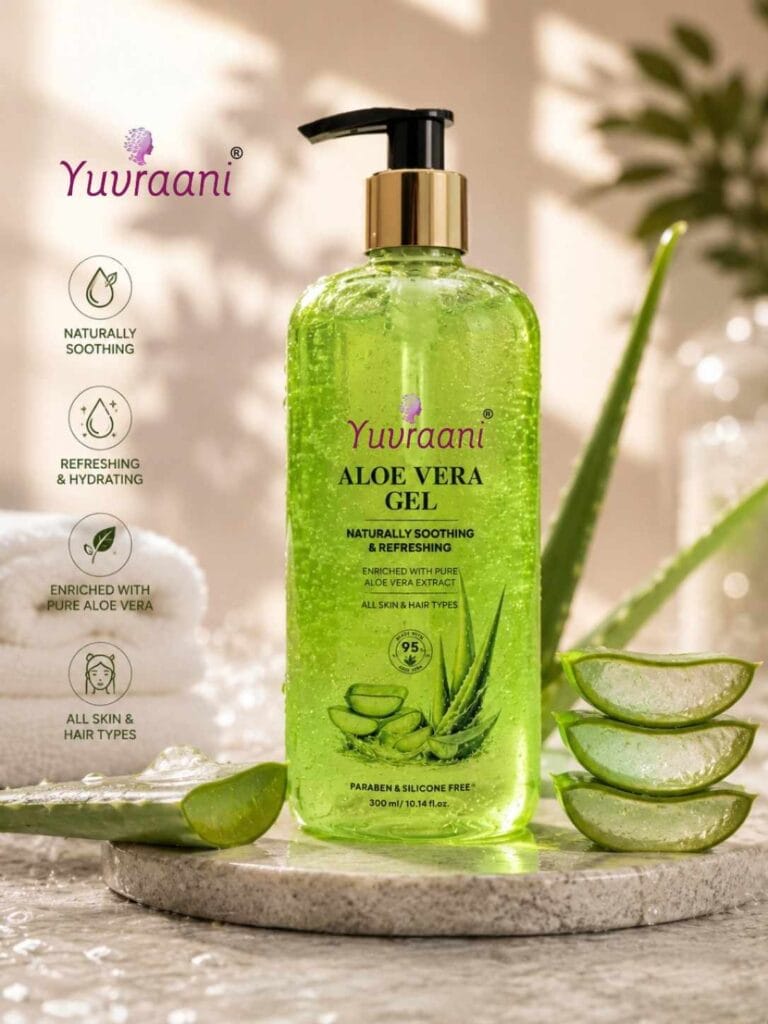 Yuvraani Aloe Vera Gel pump bottle with fresh aloe vera leaves resting on a minimalist concrete slab and sand backdrop